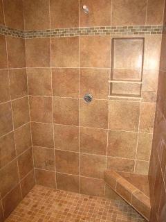 Walk in shower by labrador floors and tile