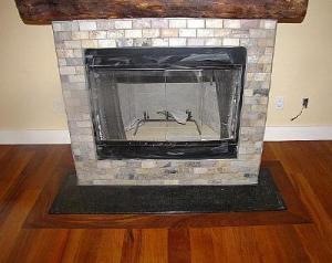 Fireplace 'brick' tiles, floor tile and wood floor installed by Labrador Floors and Tile. 